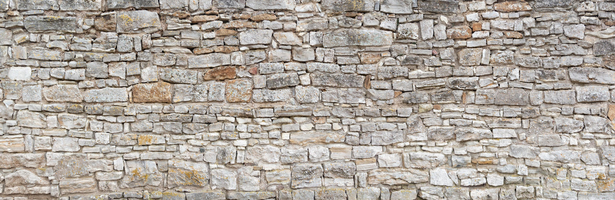 Küchenrückwand-Gräuliche alte Mauer aus groben Steinen